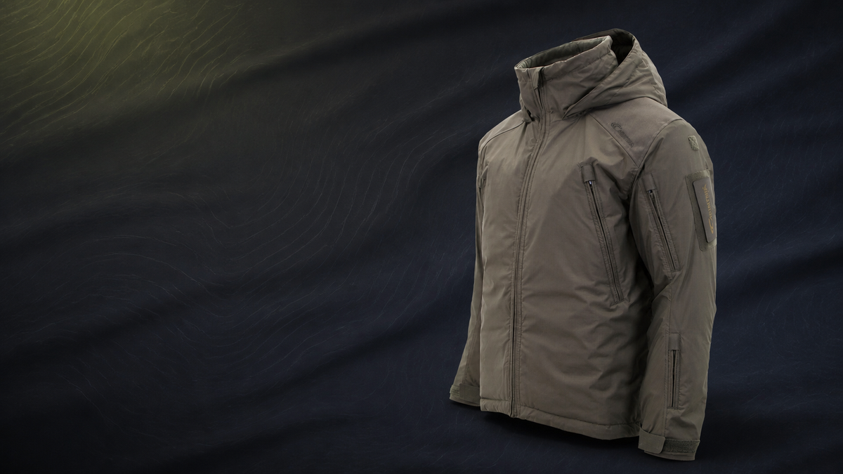 Carinthia MIG 4.0 technical jacket in olive on a dark navy background